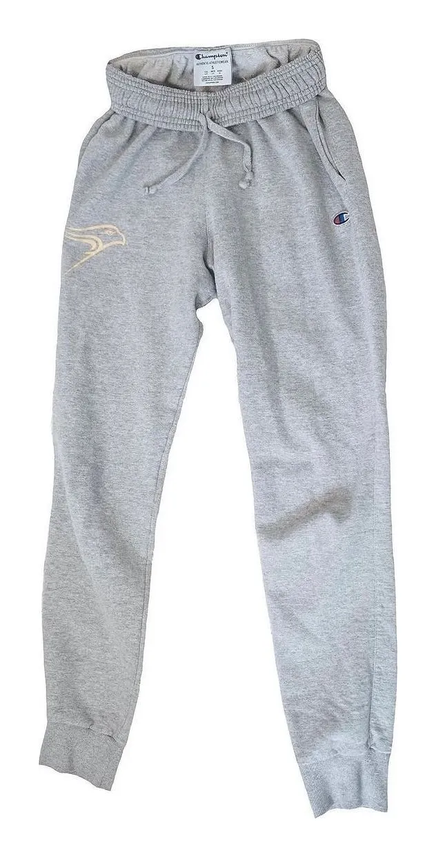 A pair of grey Champion sweatpants with a gold bird logo on one leg, laid flat