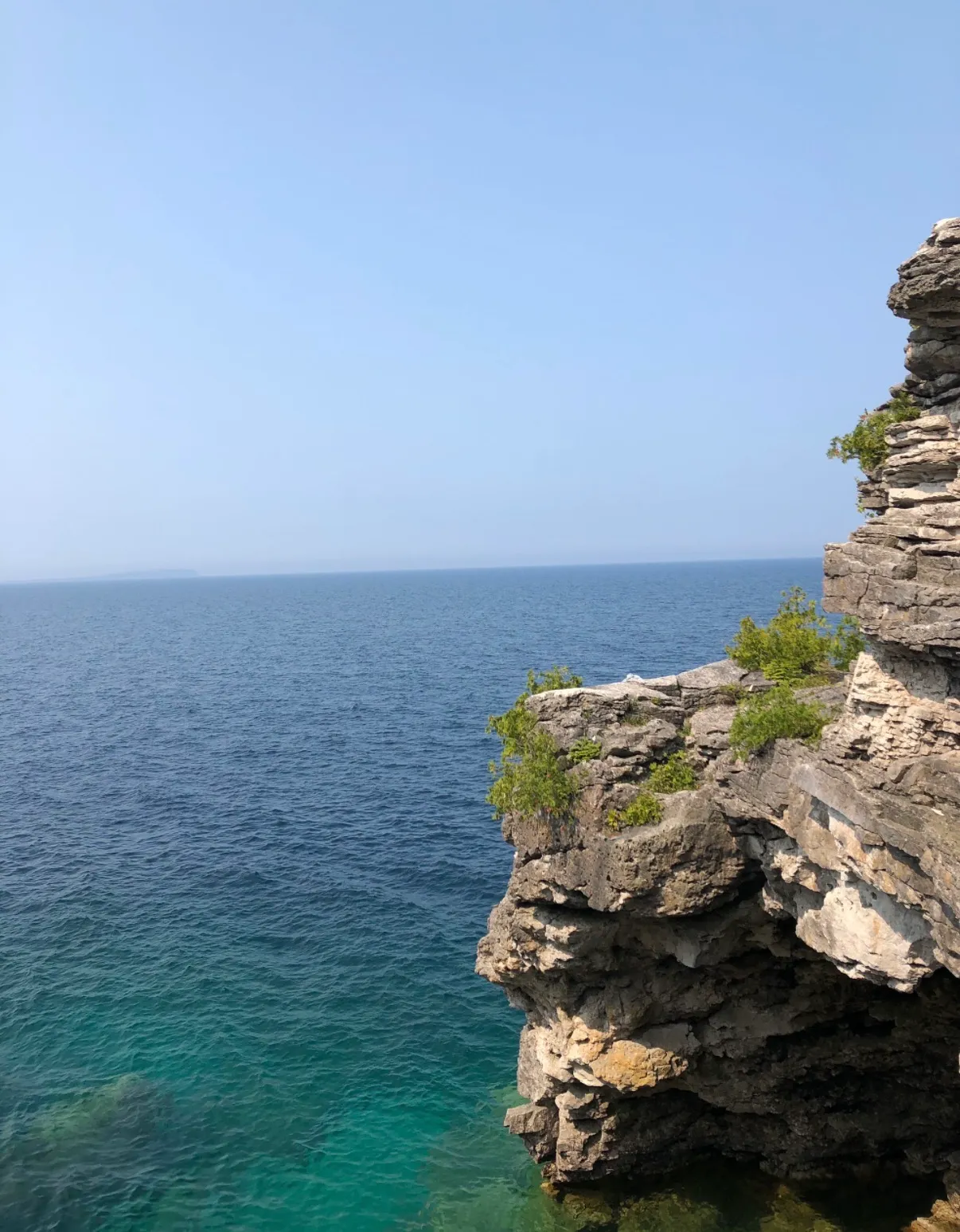 Granite cliff and open water
